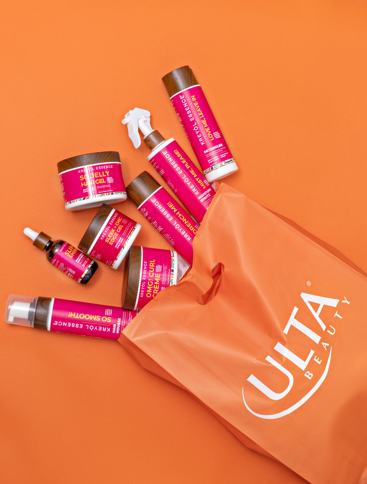 Kreyòl Essence hair care products with an Ulta Beauty shopping bag, representing national retail distribution built through market development consulting
