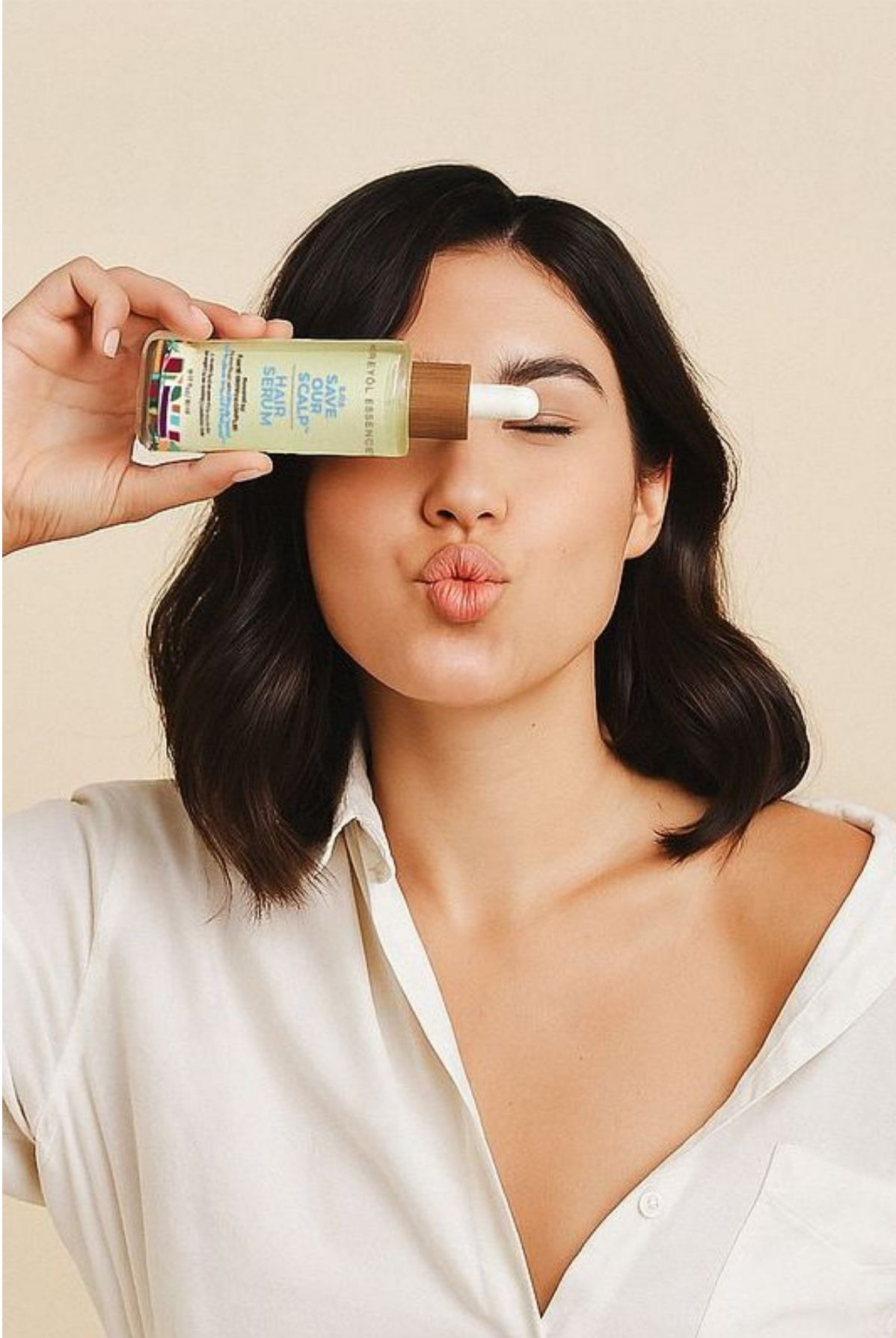 A customer holding a Kreyòl Essence product